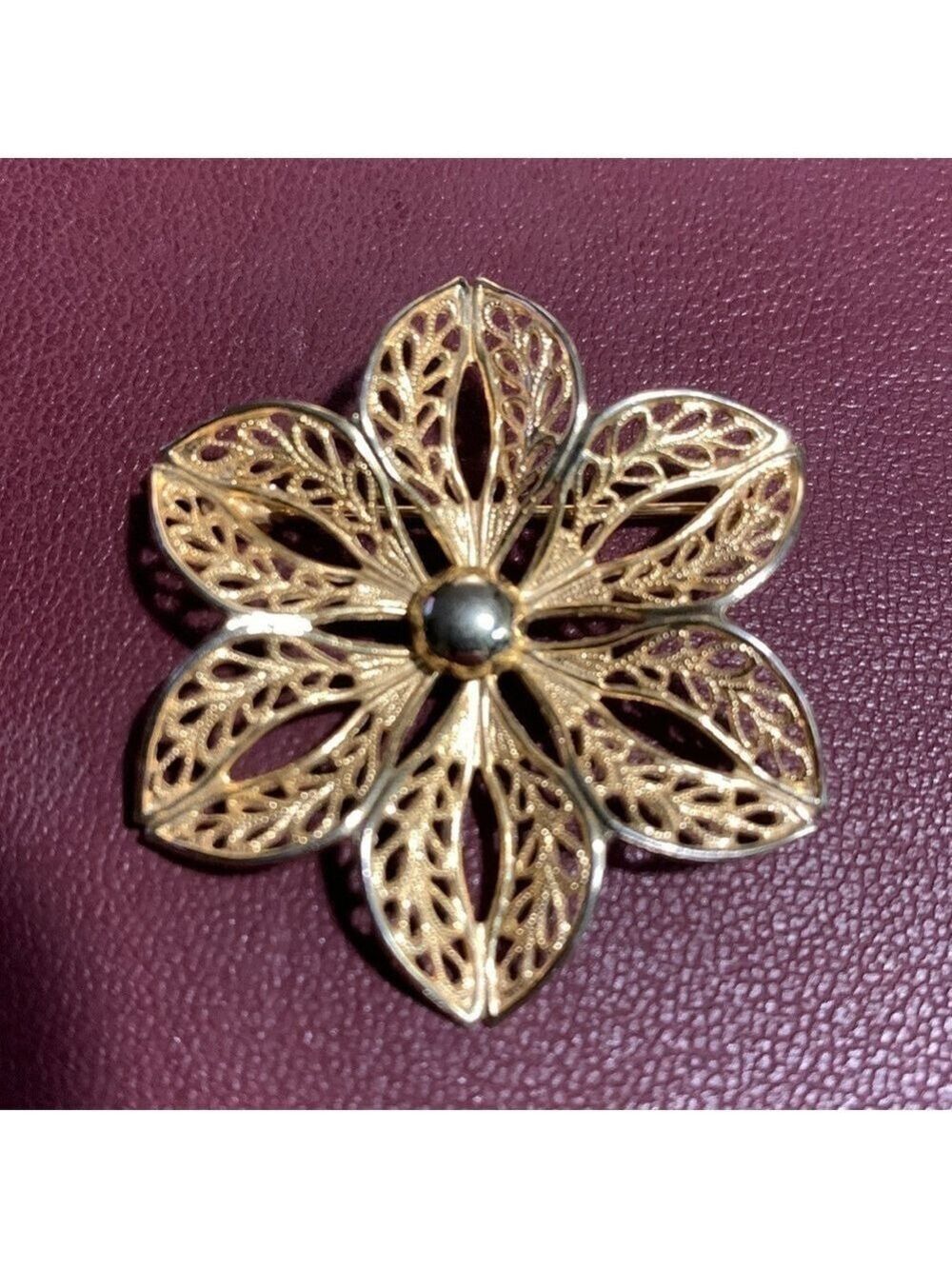 Vintage gold tone filigree flower brooch